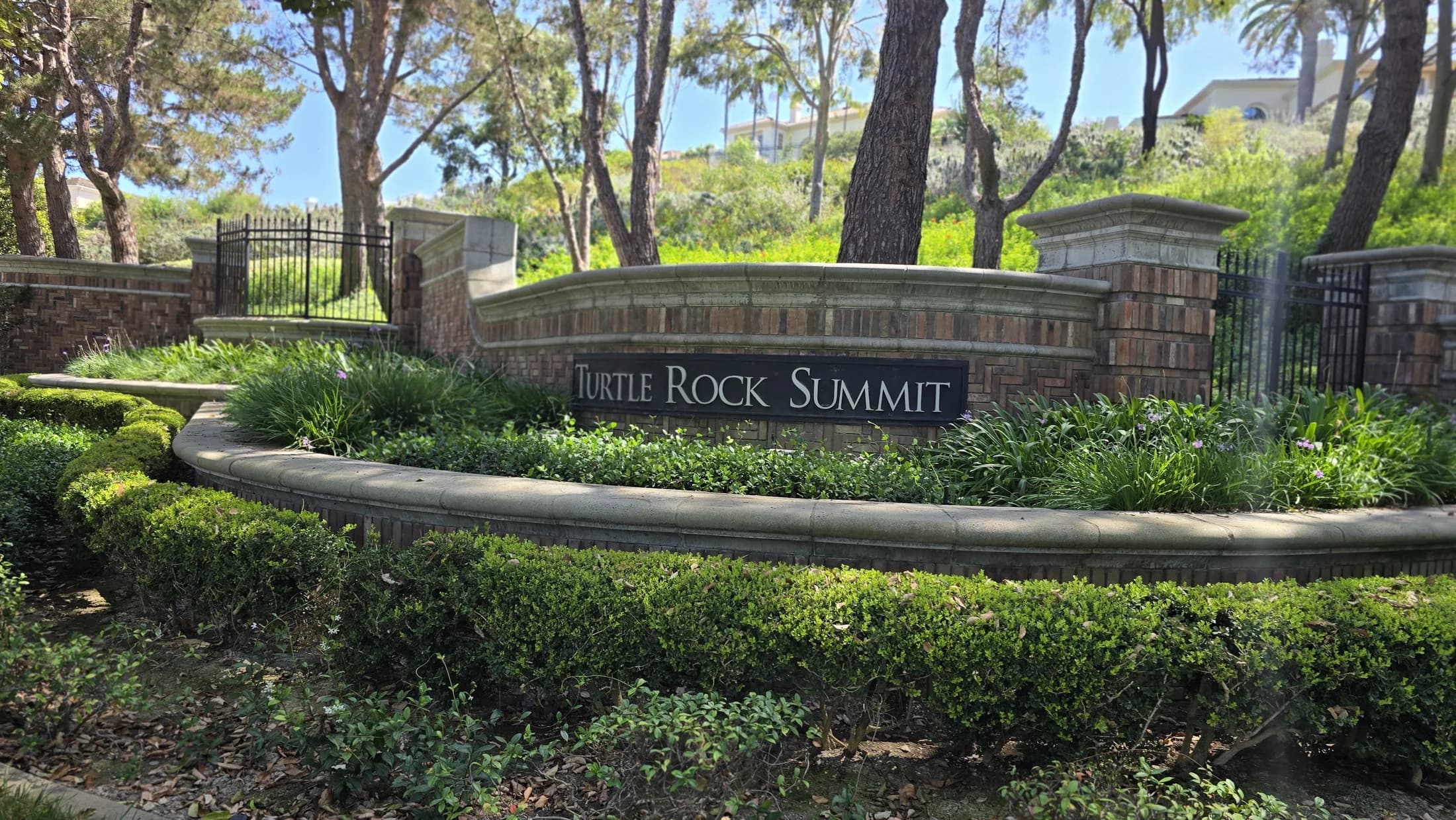 Turtle Rock Summit monument sign in landscaped community grounds